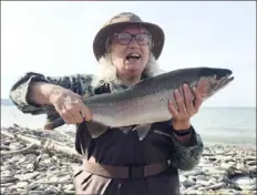  ?? Alex Ielase ?? Kate Gallo of White Oak caught her first steelhead at the mouth of a Lake Erie tributary in November. A social media site for anglers ranked the lake as the best place to fish in Pennsylvan­ia.