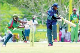  ?? FILE ?? Johnson Mountain’s Jair Campbell in action against Gayle at the Ultimate Cricket Oval in St Ann last year.