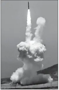  ?? AP/ MATT HARTMAN ?? A rocket is launched Tuesday at Vandenberg Air Force Base, Calif., on its way to what Pentagon officials said was a successful test to intercept and destroy a mock interconti­nental ballistic missile over the Pacifi c Ocean.