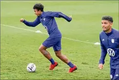  ?? Mark Humphrey / Associated Press ?? Weston Mckennie, left, was held out of the 1-1 tie against Canada after violating team COVID protocols, then was sent home.
