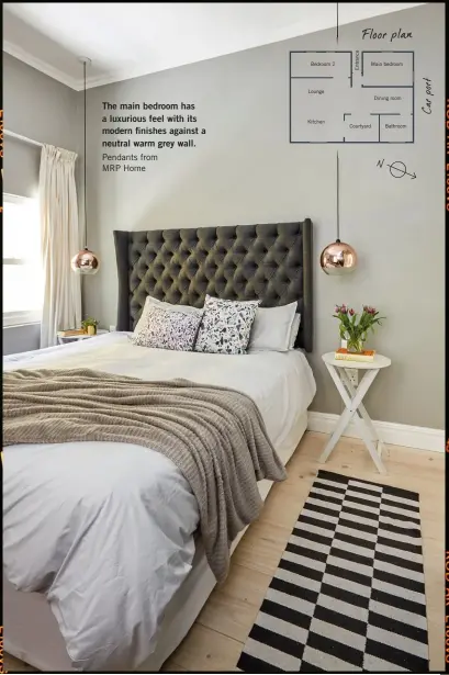  ??  ?? The main bedroom has a luxurious feel with its modern finishes against a neutral warm grey wall.