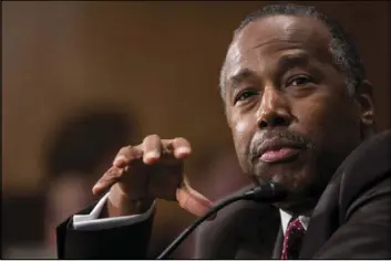 ?? ZACH GIBSON/THE ASSOCIATED PRESS ?? Housing and Urban Developmen­t Secretary-designate Ben Carson, seen testifying on Capitol Hill on Thursday, told senators that the 30-year mortgage could survive without a government guarantee.