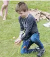  ??  ?? Yolk’s on you . . . Nick Rush (6), of Wellington, is on the receiving end of a bad egg during family games at the beach carnival.