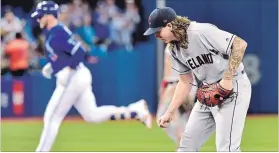  ?? FRANK GUNN THE CANADIAN PRESS ?? Blue Jays slugger Justin Smoak rounds the base after hitting a two-run home run off of Cleveland Indians pitcher Mike Clevinger in AL baseball action in Toronto on Sunday.