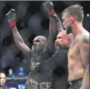  ?? Kyusung Gong The Associated Press ?? Jon Jones has his arm raised after beating Alexander Gustafsson, right, at UFC 232 on Dec. 29 in Inglewood, Calif.