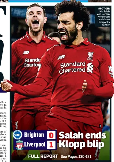  ??  ?? SPOT ON: Mo Salah and Jordan Henderson celebrate Liverpool’s winner