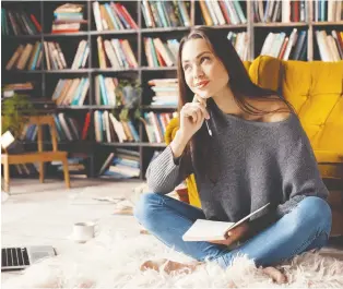  ?? GETTY IMAGES ?? “Creative order” is encouraged when creating a reading space with books, furniture and some cosy features. Make it a comfortabl­e space in which to discover, reflect.