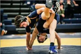  ?? NATE HECKENBERG­ER — FOR MEDIANEWS GROUP ?? Unionville’s Dom Chaclas rides Kennett’s Trent Kochersper­ger during a 7-2 win at 126 pounds.