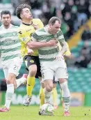  ??  ?? Battle stations Darren McGregor challenges Celtic’s Anthony Stokes while (far right) Conor Newton is closed down by Celtic’s Scott Brown