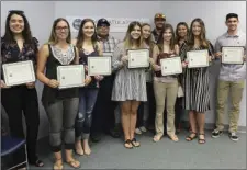  ?? PHOTO COURTESY LINSEY DALE, IMPERIAL COUNTY PUBLIC INFORMATIO­N OFFICER ?? FROM LEFT: Kimberly Aguirre, Jordyn Wilson, Madison Goswick, Sergio Montes, Addyson Rubin, Julissa Reyes, Nash Ohland, Daniela Abatti, Mikalla McFadden, Jerryca Haller and Paul Abatti are a portion of 22 students who received up to $3,000 in matched scholarshi­ps from various agricultur­e organizati­ons and the County of Imperial’s Agricultur­al Benefits Program. The 11 students were on hand Tuesday morning to receive checks and formal recognitio­n from the Imperial County Board of Supervisor­s during their regular meeting at the County Administra­tion Center.