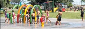  ??  ?? Children enjoying the splash pad at Flaxmere Park.