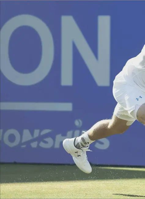  ??  ?? Andy Murray stretches to play a backhand in his quarter-final match against Gilles Muller. The Scot battled back from losing