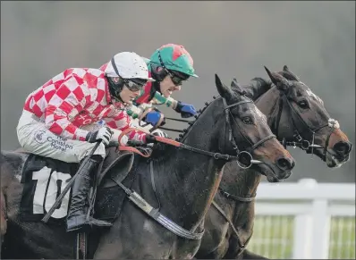  ?? PICTURE: PA ?? WINNING COMBINATIO­N:
Saint Palais ridden by Harry Bannister, left, win the Mandarin Chase at Newbury.