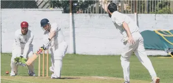  ??  ?? Seaham Park batsman Neil Young off the bowling of Philadelph­ia’s Will Orchin, as wicket keeper Matthew Noble watches on.