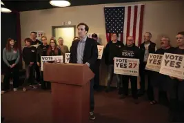  ?? STEPHEN GROVES — THE ASSOCIATED PRESS ?? Matt Schweich, center, speaks at a Wednesday news conference in Sioux Falls, South Dakota to launch a statewide voter registrati­on tour. Schweich is managing South Dakota's ballot campaign to legalize recreation­al marijuana for adults.