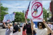  ?? MIKE MOORE/THE JOURNAL-GAZETTE VIA AP ?? Demonstrat­ors line up to protest U.S. Attorney General Jeff Sessions and immigratio­n reform at Parkview Field in Fort Wayne, Ind. Thursday, June 14, 2018.