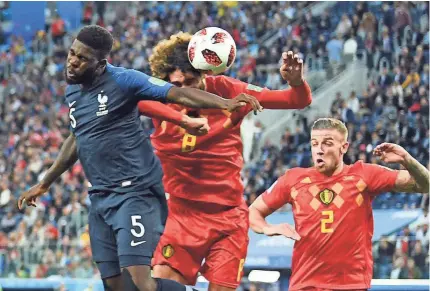  ?? TIM GROOTHUIS/WITTERS SPORT/USA TODAY SPORTS ?? France defender Samuel Umtiti (5) heads the ball in for a goal past Belgium midfielder Marouane Fellaini (8) during the second half in the World Cup semifinals in St. Petersburg, Russia, on Tuesday.