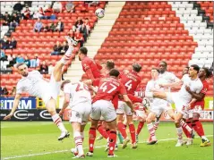  ?? ?? FULL STRETCH: Barnsley’s Adam Phillips attempts an acrobatic effort