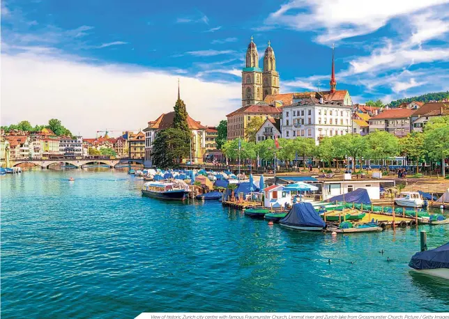  ??  ?? View of historic Zurich city centre with famous Fraumunste­r Church, Limmat river and Zurich lake from Grossmunst­er Church. Picture / Getty Images