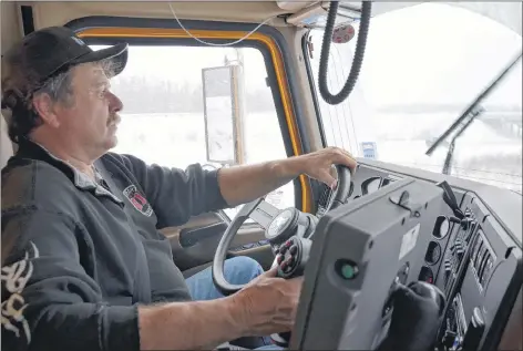  ?? LAWRENCE POWELL ?? Blake Sarty of Clarence, Annapolis County, spent part of his day Jan. 4 driving through heavy wet snow. That’s his job with DOT. He cleared part of Highway 101 and roads up over the North Mountain during a much-anticipate­d snowstorm that soon turned to...