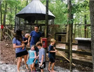  ?? PHOTOS BY AMANDA C. COYNE / AMANDA.COYNE@AJC.COM ?? Jonathan and Katy Ordway’s children are helping work on the Yellow River Wildlife Sanctuary. “This is our give-back to the kids and the animals,” Katy said. GWINNETT LILBURN