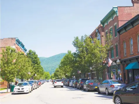  ?? Barry Winiker / Getty Images ?? Beacon, N.Y., attracts weekend visitors along its main drag.