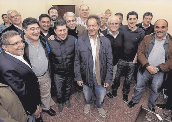  ?? Télam ?? Beder Herrera, Zannini, Casas, Fernández, Scioli, Taiana y Manzur, en La Rioja