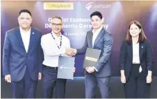  ?? ?? (From left) Maybank Group chief sustainabi­lity officer Shahril Azuar Jimin, Syed Ahmad, Shah Yang, and Gentari Green Mobility chief customer officer Aliah Nasreen Abdullah at the official exchanges of documents ceremony.
