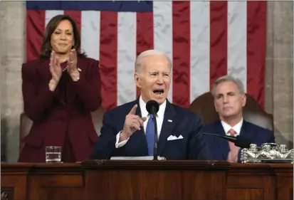  ?? JACQUELYN MARTIN-POOL — GETTY IMAGES ?? U.S. President Joe Biden delivers the State of the Union address to a joint session of Congress as Vice President Kamala Harris and House Speaker Kevin McCarthy listen on Tuesday in the House Chamber of the U.S. Capitol in Washington.