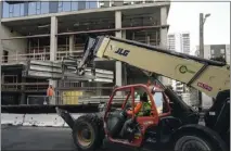  ?? JIM WILSON — THE NEW YORK TIMES ?? A constructi­on worker at a job site in Oakland last month. The nation's payrolls grew by 336,000in September on a seasonally adjusted basis.