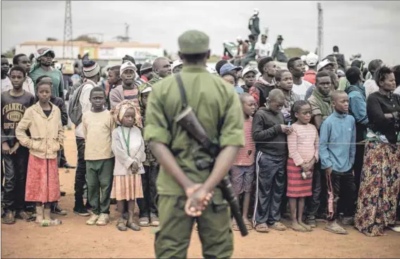  ??  ?? High-stakes election: Supporters of President Edgar Lungu during his 2016 campaign (above). Those polls were marred by violence against opposition supporters (left), which analysts worry could return.