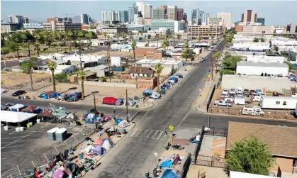  ?? ?? A homeless encampment in Phoenix, the capital of Arizona. Photograph: Mario Tama/Getty Images