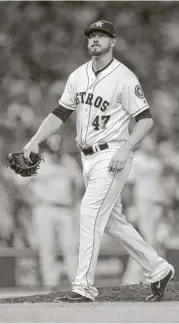  ?? Karen Warren / Houston Chronicle ?? Chris Devenski leaves the mound after walking two of the four batters he faced in an Aug. 5 game against the Blue Jays.