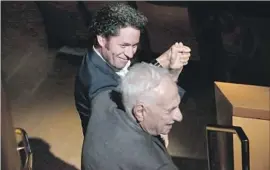  ?? Genaro Molina Los Angeles Times ?? L.A. PHILHARMON­IC’S Gustavo Dudamel, left, with architect Frank Gehry on Thursday at Disney Hall, where the orchestra’s centennial plans were announced.