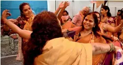  ?? —AP ?? CELEBRATIO­N: Hindu women dance to celebrate ahead the groundbrea­king ceremony of Ram temple at the Vishwa Hindu Parishad headquarte­rs in New Delhi.