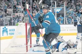  ?? SHAE HAMMOND — BAY AREA NEWS GROUP ?? The San Jose Sharks’ Tomas Hertl (48) celebrates with Jasper Weatherby (26) after scoring a goal against the Winnipeg Jets in the third period at the SAP Center in San Jose on Saturday.