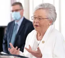  ?? MICKEY WELSH/THE MONTGOMERY ADVERTISER VIA AP ?? Alabama Gov. Kay Ivey gives a COVID-19 update at the Alabama Capitol Building in Montgomery, Ala., on Thursday. With states including Texas and neighborin­g Mississipp­i ending masking requiremen­ts, Ivey announced Thursday that masks will be required in the state of nearly 5 million people through April 9.