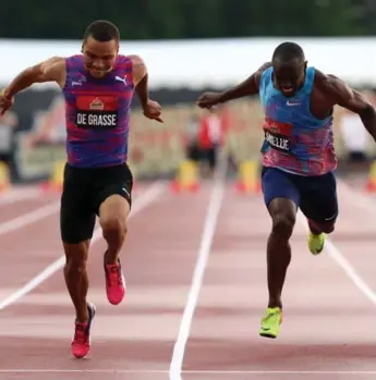  ?? FRED CHARTRAND/THE CANADIAN PRESS ?? Andre De Grasse, left, has gone back to back to back in the 100 at the Canadian championsh­ips. He won gold Friday ahead of Brendon Rodney, not pictured, and Gavin Smellie.