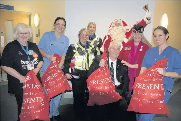  ?? PETER BOLTER ?? After the loss of two of their members to cancer this year, Bridgend Disabled Veterans’ annual Random Act of Kindness took place at Princess of Wales Hospital, Bridgend, where both members were treated, in order to thank staff