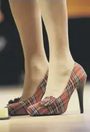  ??  ?? 0 Nicola Sturgeon’s tartan high heels exemplify power dressing