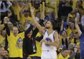 ?? JEFF CHIU — THE ASSOCIATED PRESS ?? Stephen Curry celebrates after scoring against the Trail Blazers during the second half of Game 1 of their first-round playoff series on April 16 in Oakland, Calif.