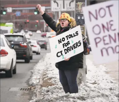  ?? Jessica Hill / Associated Press ?? Hilary Gunn, of Greenwich, in a file photo, protested against the concept of highway tolls.