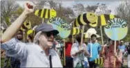  ?? THE ASSOCIATED PRESS ?? People gather for a climate rally on Boston Common in Boston, Saturday. Organizers say they’re marking President Donald Trump’s first 100 days in office by protesting his agenda so far.