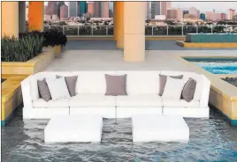  ?? Ledge Lounger ?? The Ledge Lounger in-pool Signature sectional and table is made up of modular pieces that can be connected into different arrangemen­ts to fit your space. The sectional’s high-quality cushions are available in more than 300 color and pattern options and are made of outdoor Sunbrella fabrics and EZ-DRI foam core.