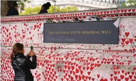  ?? Photograph: Alberto Pezzali/AP ?? The National Covid Memorial Wall, on the south bank of the Thames in London.