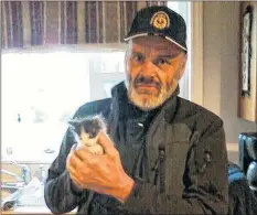  ?? CONTRIBUTE­D ?? Tim Wells visits with Gypsy, a kitten that Vivian Wells, his younger sister, adopted in 2017. Vivian remembers her brother as someone who was very kind and thoughtful