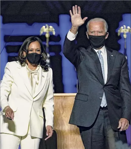  ?? Andrew Harnick / Getty Images ?? U.S. President-elect Joe Biden and Vice President-elect Kamala Harris deliver remarks Saturday evening in Wilmington, Del., after being declared winners of the presidenti­al election by numerous media organizati­ons.