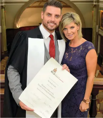  ??  ?? Keith Duffy (with his wife Lisa) w as awarded an honorary fellowship for autism work by RCS