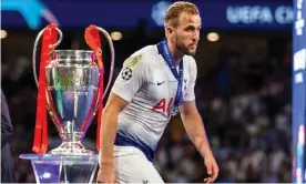  ?? Photograph: Shaun Brooks/Action Plus via Getty Images ?? Harry Kane walks past the European Cup after defeat by Liverpool last year, the closest he has come to silverware with Tottenham.