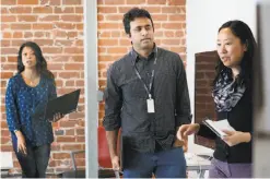  ??  ?? Ecovacs Robotics management team members Janice Lerit (left), Raman Chari and Shirley Xue meet at their San Francisco office.